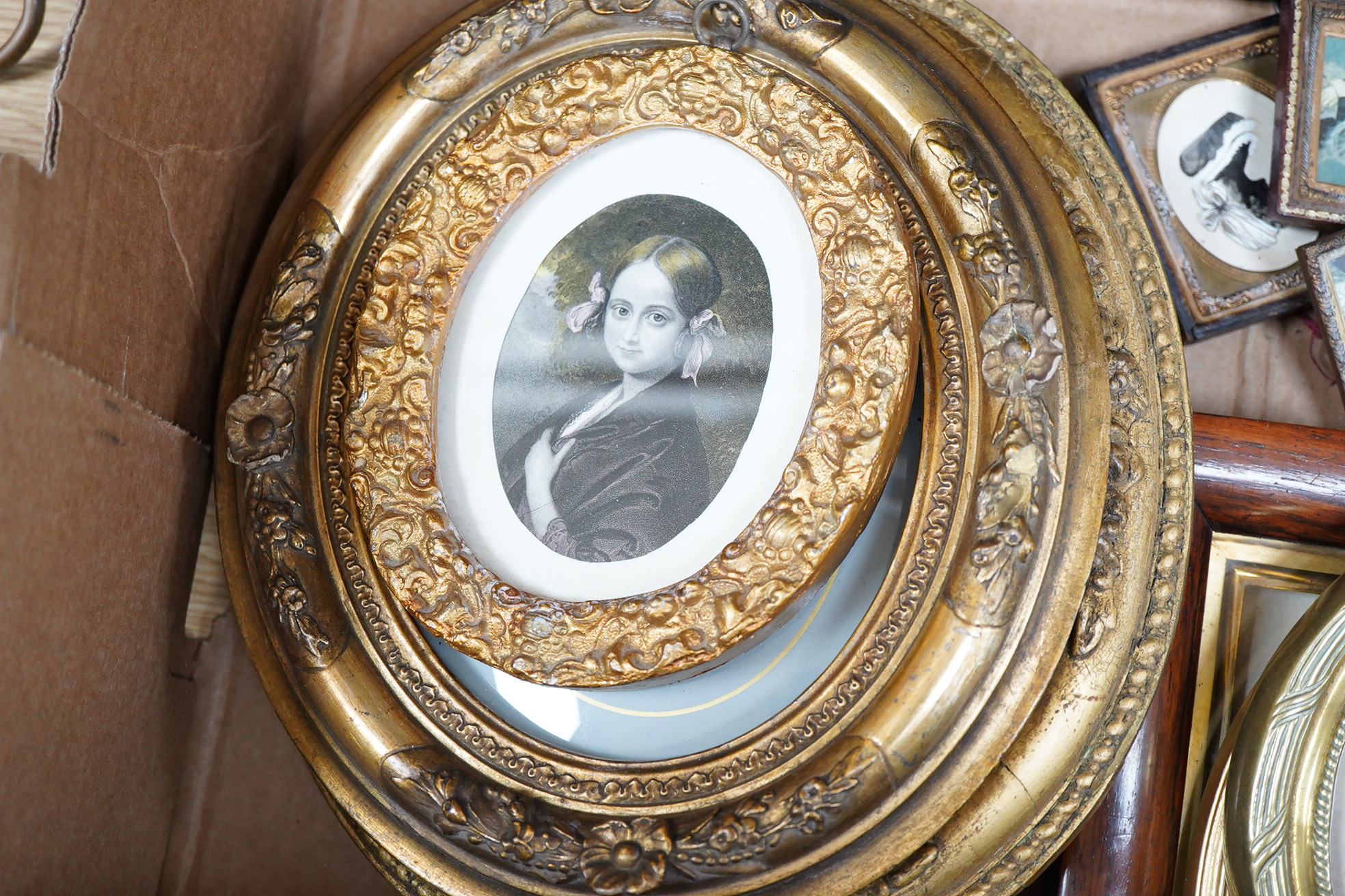 A collection of watercolour and printed miniatures and frames to include: 19th century and later oval silhouette portraits, one rosewood framed, various ebonised and partially gilt frames and a comical watercolour, hunti